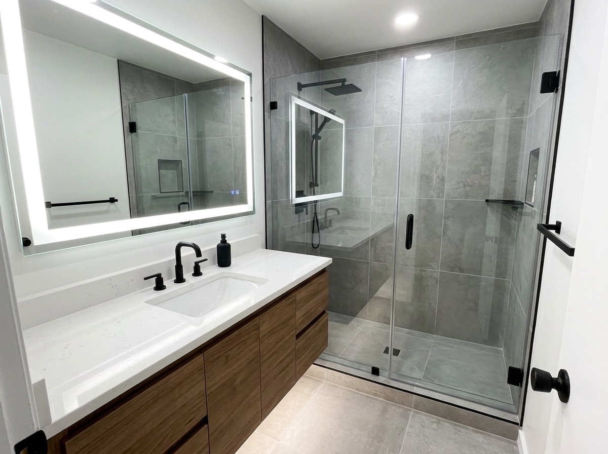Modern gray bathroom with walk-in shower after remodeling